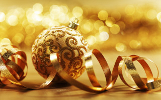 Golden ornament ribbon bokeh lights - a gold background free wallpaper