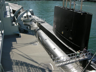 Submarine docked man deck water - a submarine free wallpaper