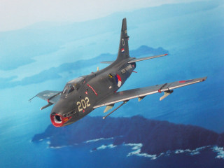 Fighter jet mountain sky red - over a mountain range in the sky free wallpaper