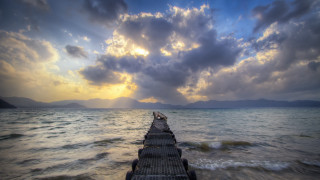 Pier ocean sunset light rays - constantine andreou free wallpaper
