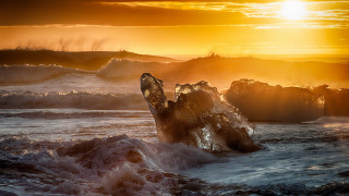 Bird rock water sunset waves - an abstract sculpture free wallpaper
