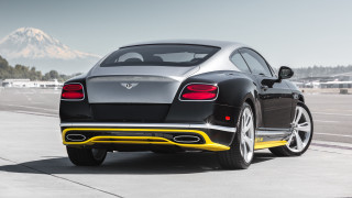 Black car yellow trim runway - a runway free wallpaper