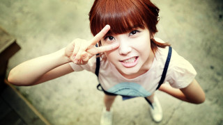 Woman peace sign standing sunny - a peace sign free wallpaper