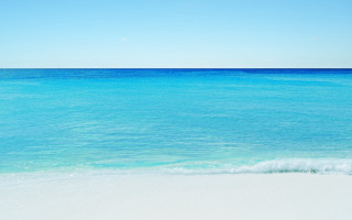 Beach ocean sky sand wave - a blue ocean free wallpaper