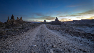 Dirt road rocks clouds mountains - free sunset wallpaper
