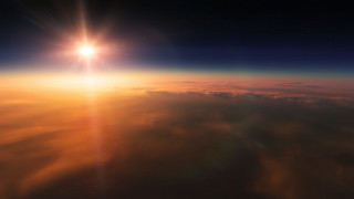 Sunrise over ocean mountain sky - a bright sun free wallpaper