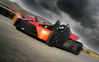 Red black sports car cloudy - a road under a cloudy sky free wallpaper