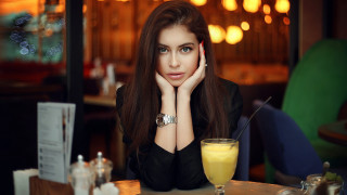 Woman sitting table orange juice 2 - a glass free wallpaper for desktop
