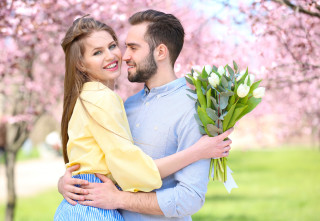 Romantic hugging couple cherryblossoms spring - free valentines wallpaper