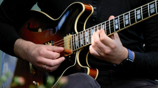 Man playing guitar black shirt - his lap free wallpaper for desktop