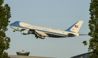 Jetliner blue sky trees building - turnaround free wallpaper