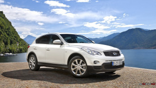 White car cobblestone road mountains - a body of water and mountains free wallpaper