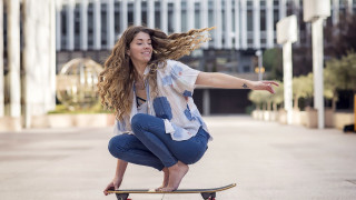 Skateboarder city clock building blurry - claire falkenstein free wallpaper