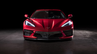 Red sports car dark room 24 - a black backdrop free wallpaper