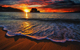 Sunset ocean waves rocks dusk - a sunset over the ocean free wallpaper