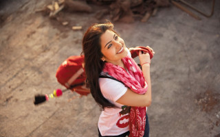 Woman red scarf backpack smiling - a dirt road free wallpaper