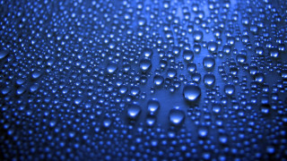 Water droplets blue surface fence - a close up of water droplets free wallpaper for desktop