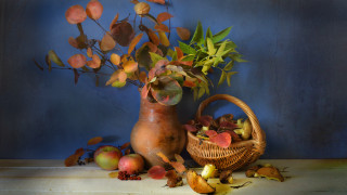 Vase leaves basket apples table - a blue wall behind free wallpaper
