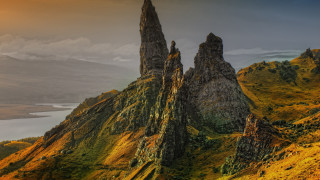 Mountain rock formation lake cloudy - a lake in the distance free wallpaper