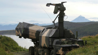 Military vehicle grassy lake mountains - a mountain range in the distance free wallpaper