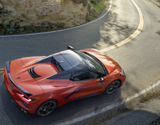 Red sports car cliff side - side profile free wallpaper