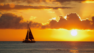 Sailboat ocean sunset cloudy sky 3 - the sun setting free wallpaper