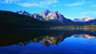 Mountain range reflection lake blue 7 - a still lake free wallpaper for desktop