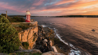 Lighthouse cliff ocean sunset boat 2 - the water below free wallpaper for desktop