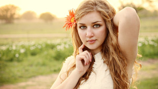 Woman long hair flower field 4 - a picture in a field of flowers free wallpaper