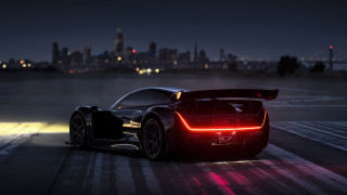 Black sports car red light 3 - a city skyline in the background free wallpaper