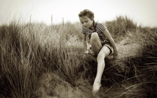 Woman sitting field tall grass - free retro wallpaper