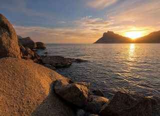 Sunset water rocks mountains orange - orange sun free wallpaper