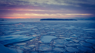 Ice water mountain sunset cityscape 2 - a small island in the distance free wallpaper for desktop