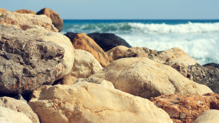 Rocks water waves beach mountains - a bunch of rocks free wallpaper