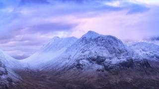 Snowy mountain range cloudy sky 5 - a few snow covered mountains free wallpaper