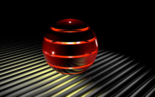 Red object on black surface - a light shining free wallpaper