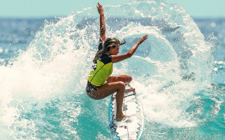 Woman surfing wave sunny ocean - a woman riding free wallpaper