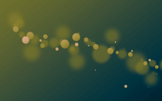 Blurry green yellow bokeh lights - circle of light free wallpaper