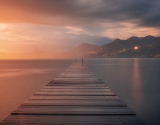 Docked mountains sunset reflection city - a long dock free wallpaper