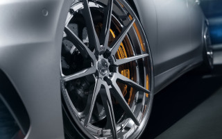 Car wheel closeup blue background - photorealism free wallpaper for desktop