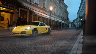 Yellow sports car cobblestone street - adam szentpétery free wallpaper for desktop