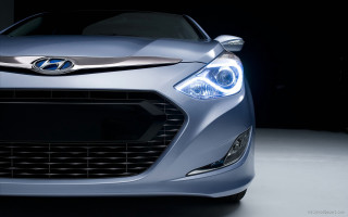 Car closeup headlight black background - a close up of a car free wallpaper