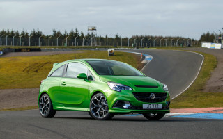 Green racecar mountain road nature - a green car free wallpaper