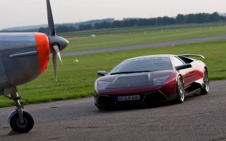 Red sports car runway plane - grass and trees free wallpaper