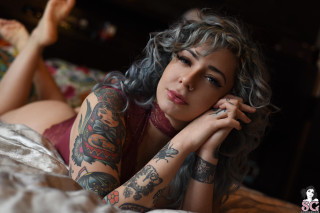 Tattooed woman bed bokeh photorealistic - cosmo alexander free wallpaper