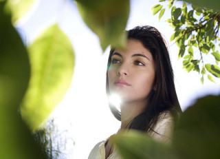 Woman sky leaves light bokeh - her face free wallpaper