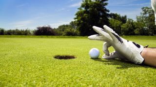 Golf ball gloves green field - a golf ball free wallpaper
