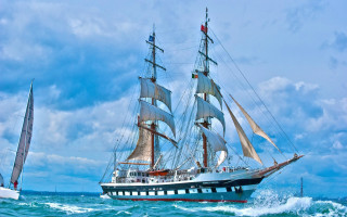 Large sailboat ocean cloudy day - a cloudy day free wallpaper