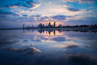City skyline reflection sunset water 2 - free city wallpaper