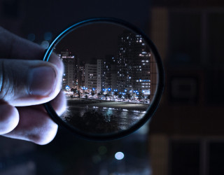 Cityscape microscopic night lights river - a magnifying glass free wallpaper